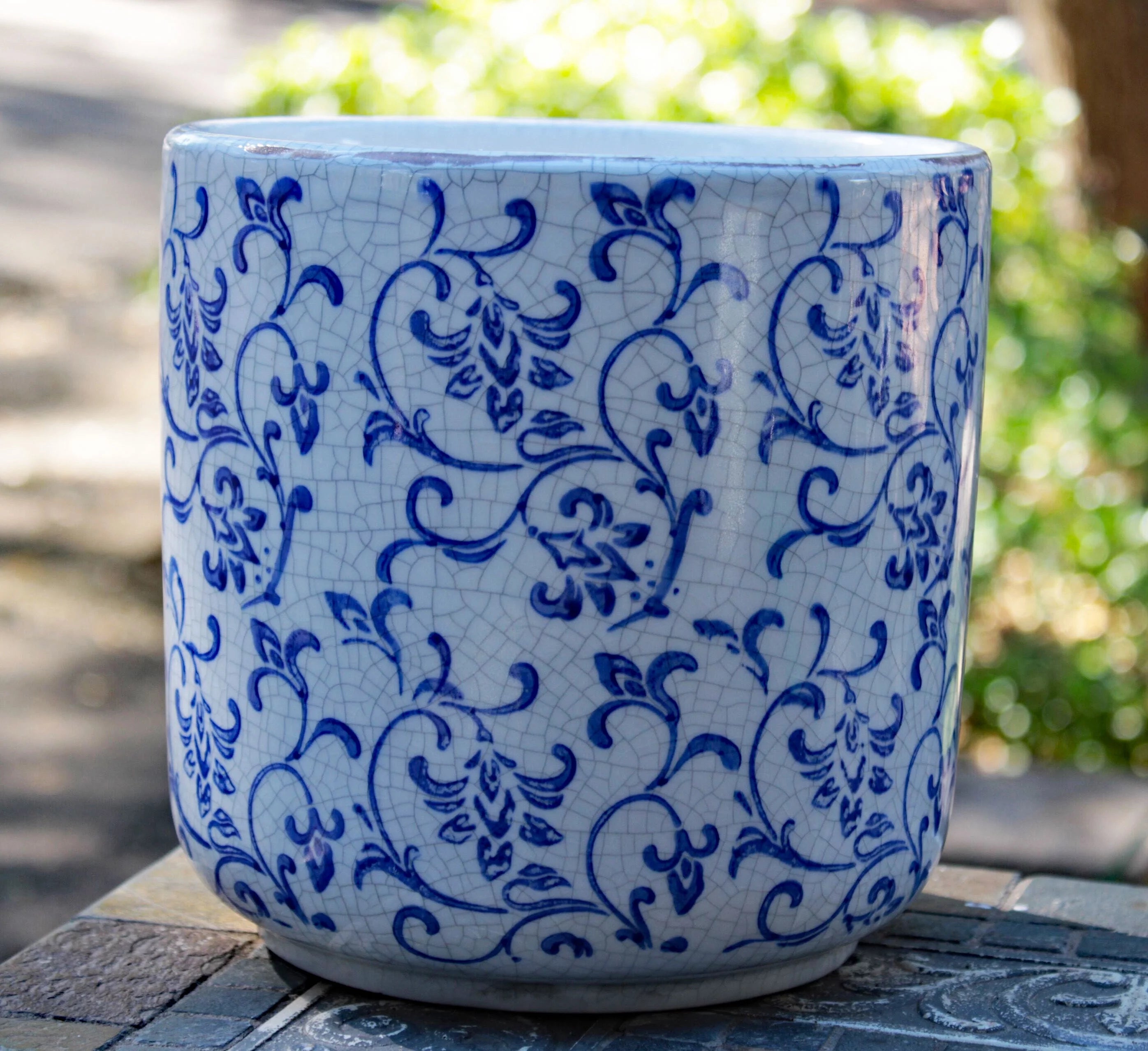 Blue and white ceramic cylindrical garden planter with vine pattern L424