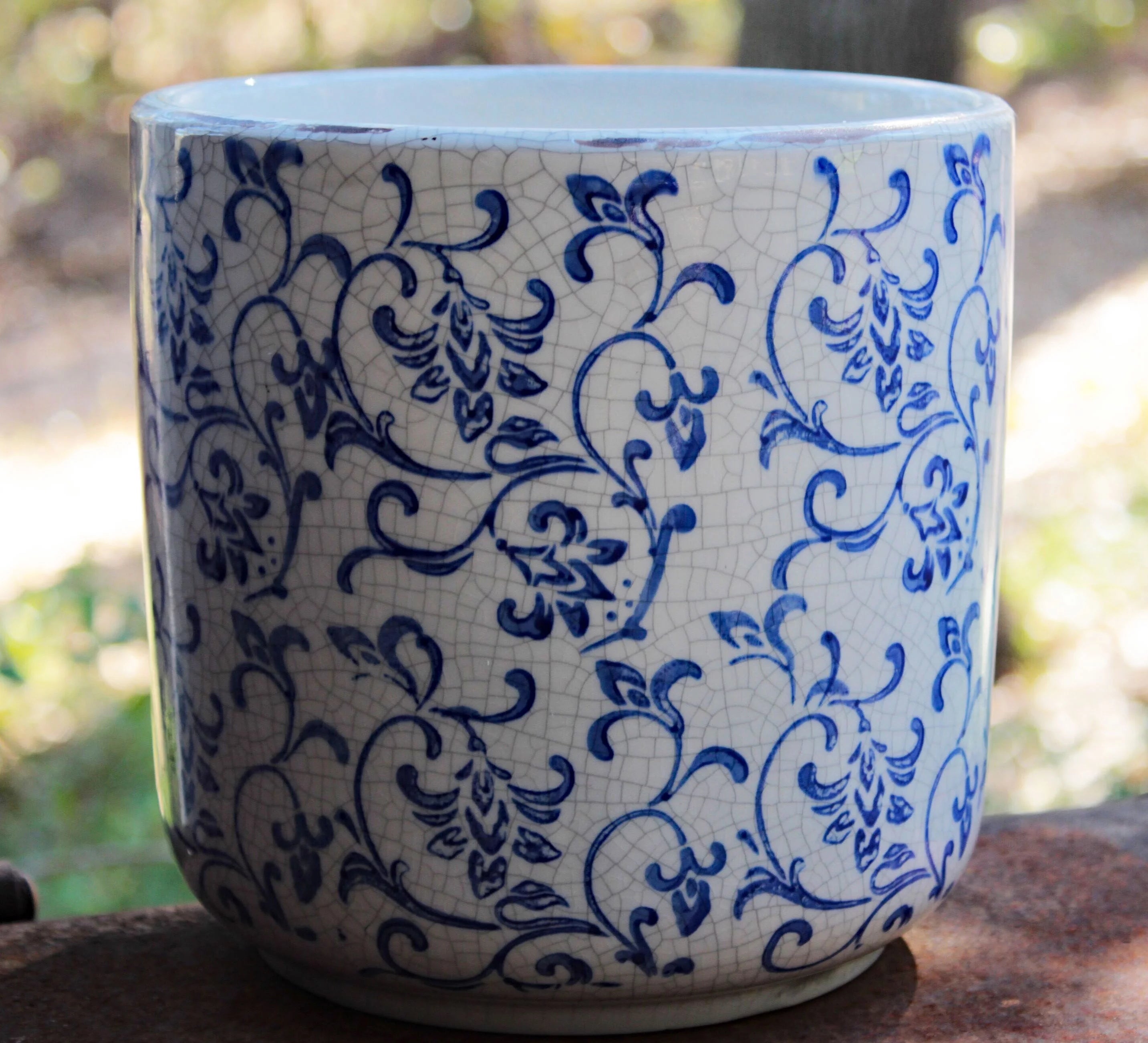 Blue and white ceramic cylindrical garden planter with vine pattern L424